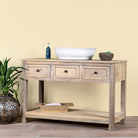 Side angle image of a sandblasted reclaimed wood bathroom console table with 3 drawers and open shelf; sustainable furniture, 120 × 50 × 80 cm.