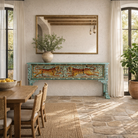 Lifestyle imagination of a hand-painted reclaimed wood console table Bunsee with tiger and leopard motifs in turquoise vintage finish. A unique piece of furniture for bohemian interiors and artistic spaces.