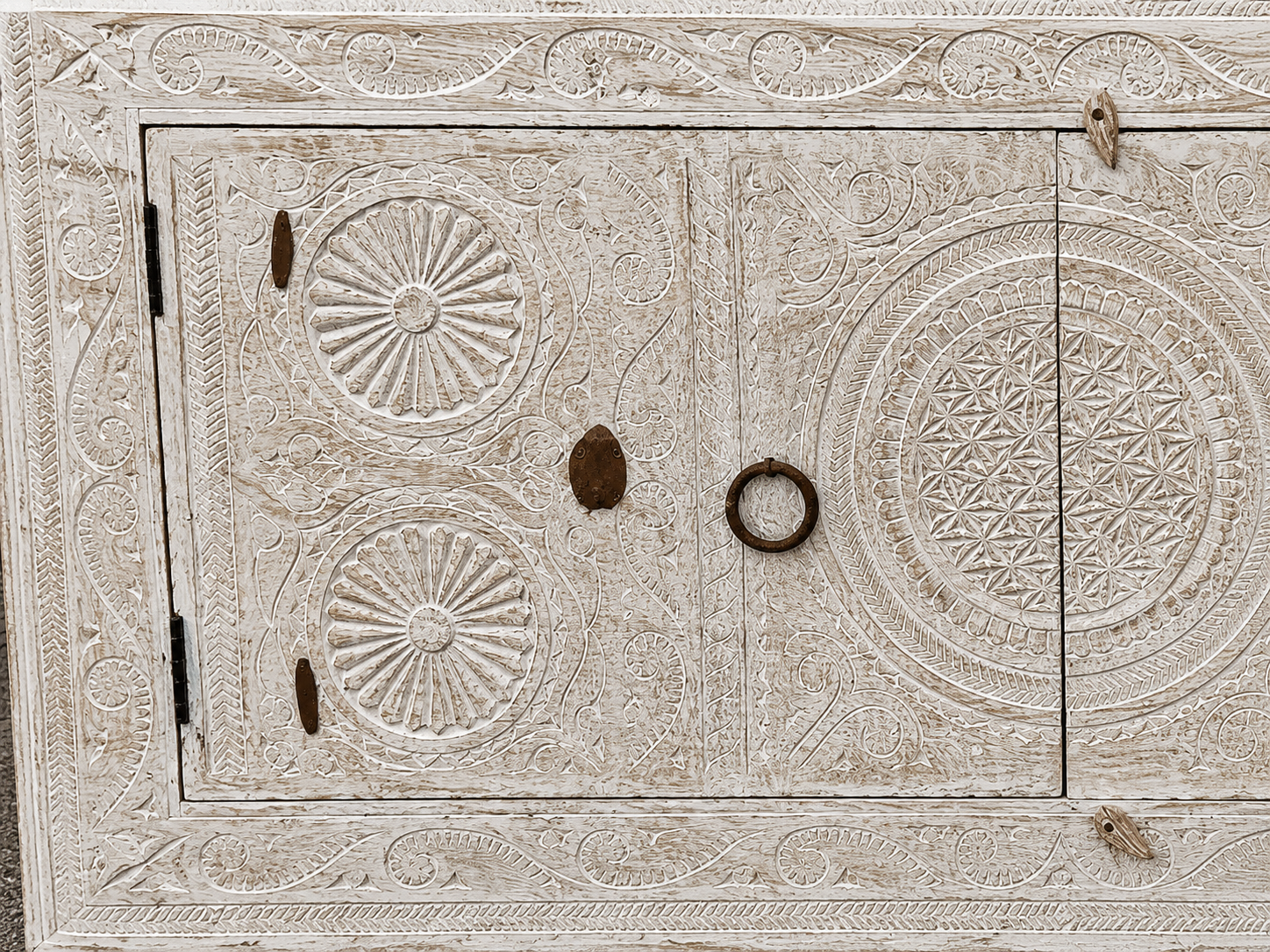 Close up image of a Calinda hand carved reclaimed wood sideboard with bleached Orissa style doors and old iron fittings 152cm