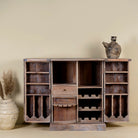 Foldable bar table made of reclaimed teak wood with inside storage and old door front.