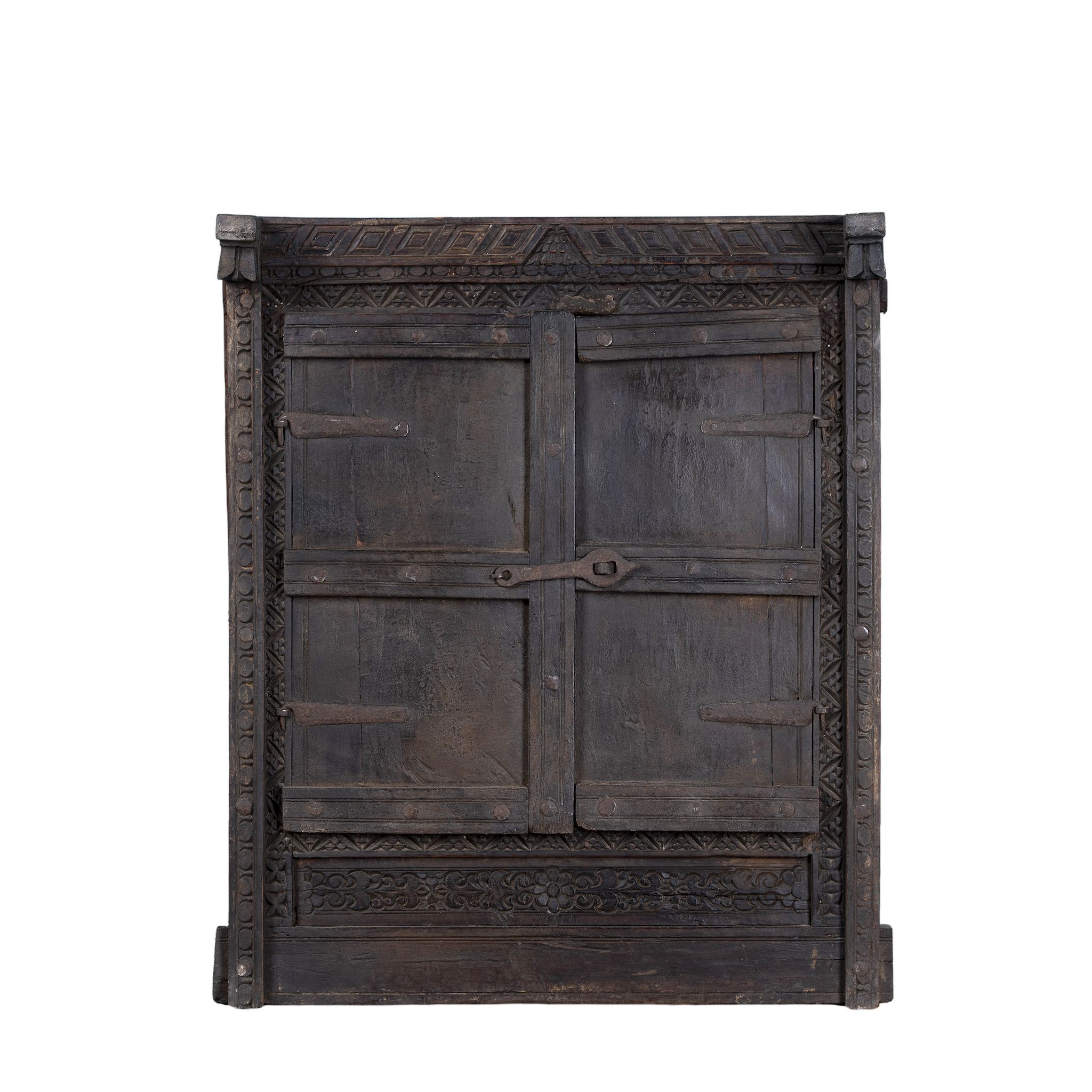 White background picture of an antique teak window mirror with shutters, vintage wall panel design, part of our vintage home accessories collection.