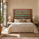 Lifestyle image of a Cauvery hand painted head board made from an antique Indian teak door, featuring traditional floral motifs in blue and cream and original iron hardware—an elegant example of hand painted head boards and authentic Indian headboards.