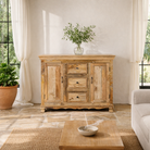Lifestyle image of a sideboard made of natural mango wood with 2 doors, 4 compartments and 2 drawers. 