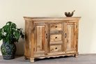 Side angle image of a sideboard made of natural mango wood with 2 doors, 4 compartments and 2 drawers. 
