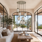 Lifestyle image of a Chahal mosaic pendant light with seven hanging mosaic lamps and round ceiling panel 60cm