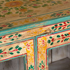 Close up image of a Chaitanya hand-painted reclaimed wood display cabinet with colourful floral design 112cm