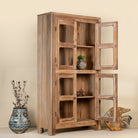 Open door image of Chander tall vitrine with reclaimed teak door panels, a refined piece of teak wood furniture for living room furniture collections.