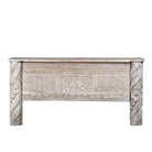 White background image of a white-washed carved console table made from reclaimed wood with floral detailing; Mediterranean and Ibiza style furniture, 160 × 80 × 48 cm.
