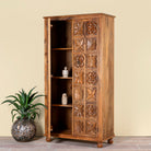 Open door image of a hand-carved mango wood wardrobe with floral motifs; wooden wardrobe in natural finish, 100 × 45 × 190 cm.