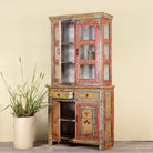 Sde angle image with open drawers of a hand-painted two-part showcase made of reclaimed wood with floral motifs; unique furniture for a boho chic living room, 94 × 48 × 203 cm.