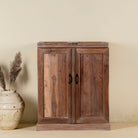 Foldable bar table made of reclaimed teak wood with inside storage.