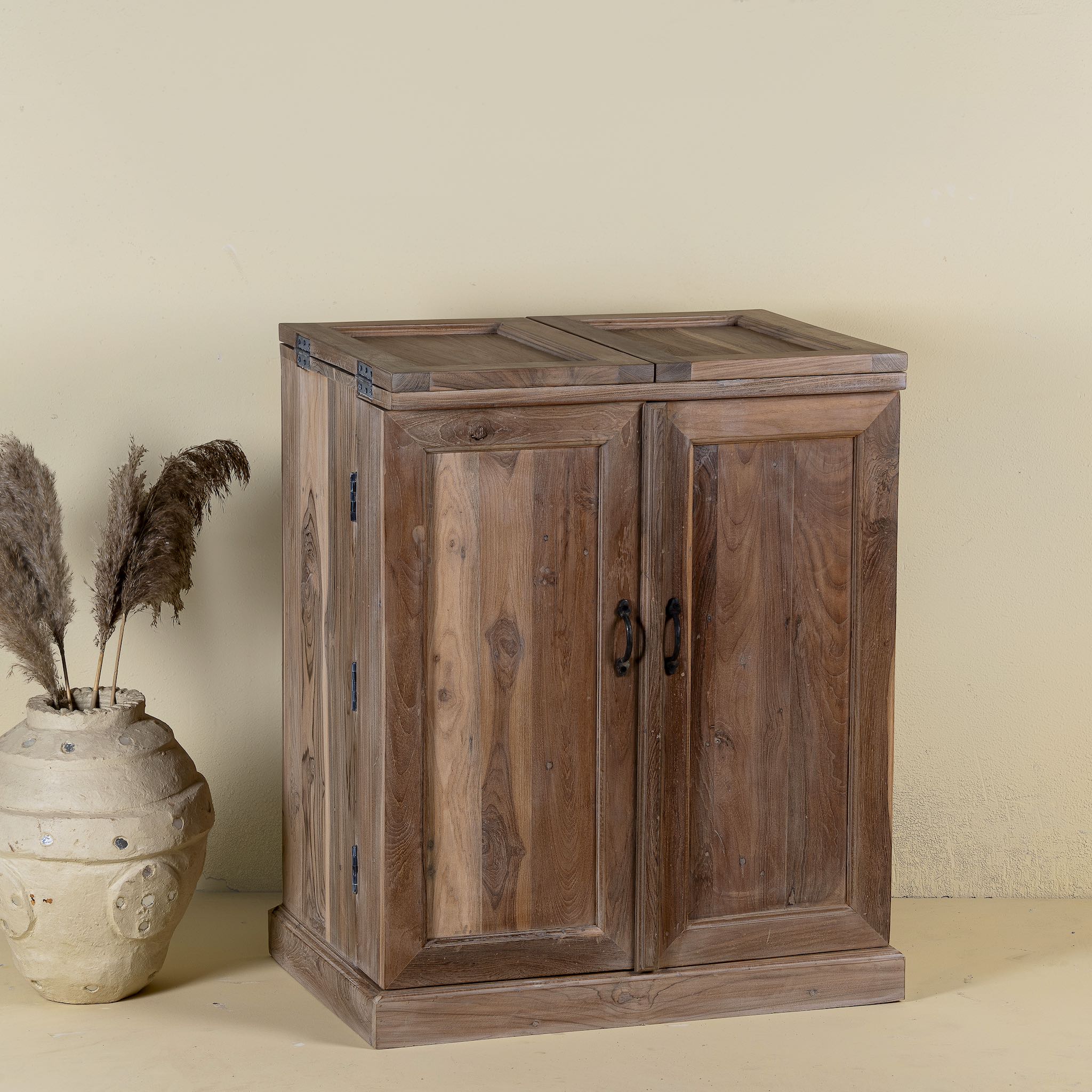 Foldable bar table made of reclaimed teak wood with inside storage.