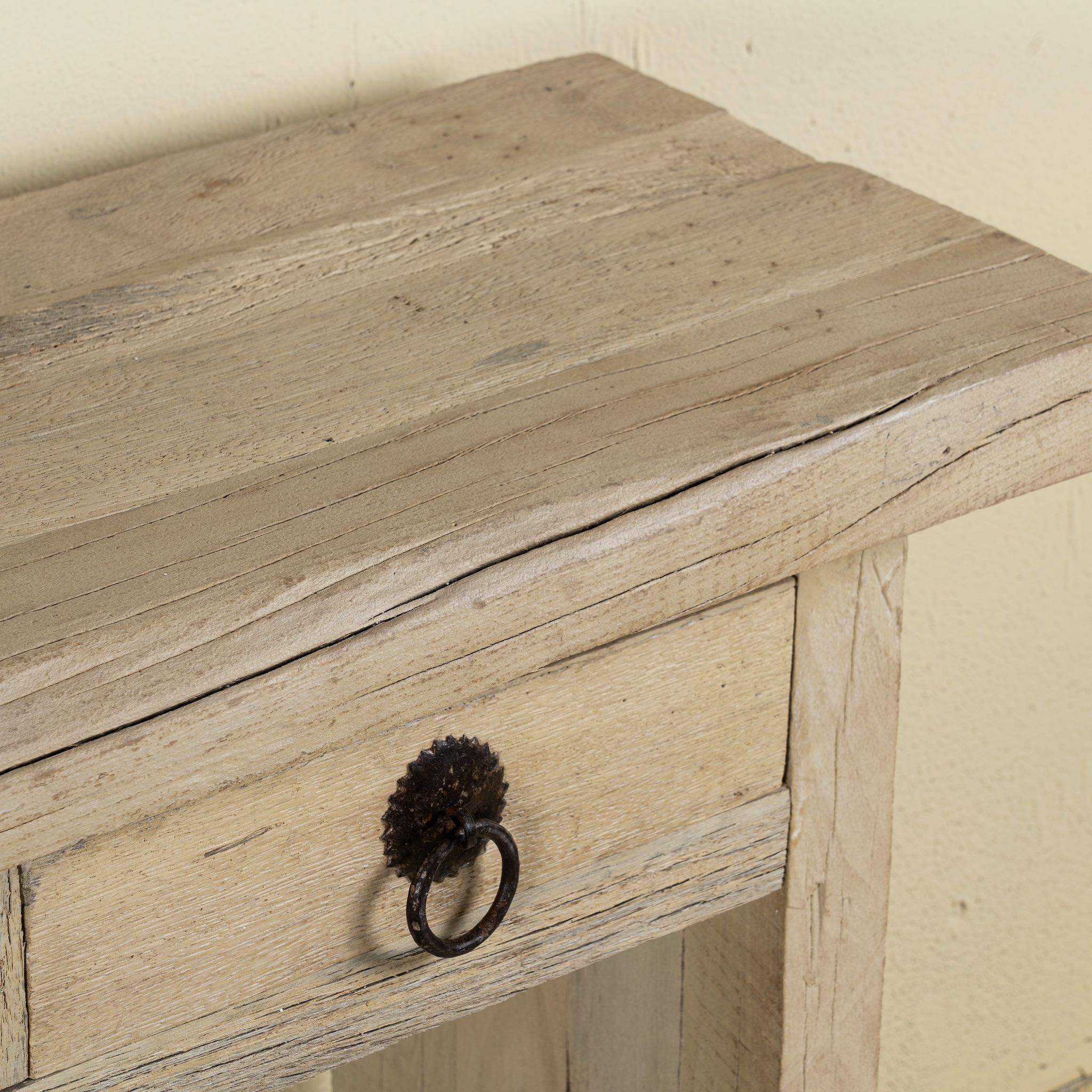 Close up image of a teak wood console table with sandblasted finish, three drawers and lower shelf; sustainable furniture for entryways, living rooms, or bathrooms, 160 × 30 × 80 cm.