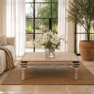 Lifestyle image of a Ibiza style coffee table teak wood, reclaimed teak with carved details; sustainable Indian coffee table, 122 × 77 × 44 cm.