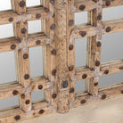 Close up of a reclaimed teakwood mirror crafted from an antique Indian door panel, featuring iron accents and mirror inlays – ideal for vintage home decor and heritage-inspired interiors.
