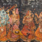 Close up image of a Dancing Ganesh antique reclaimed wood mirror with hand-painted Indian artwork on an authentic vintage reclaimed wooden mirror frame, 50x50x5cm.