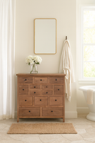 Lifestyle image of a teak furniture chest of drawers made from reclaimed old teak wood, eco-friendly sustainable furniture in Ibiza style, 100 × 40 × 100 cm.