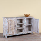 Side angle image with open door of a Devesh reclaimed wood sideboard with hand carved refurbished doors, open shelves and vintage whitewash finish 153cm