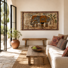 Lifestyle image of a Dhairya hand painted reclaimed Indian teak door panel wall art with elephant motif 170cm