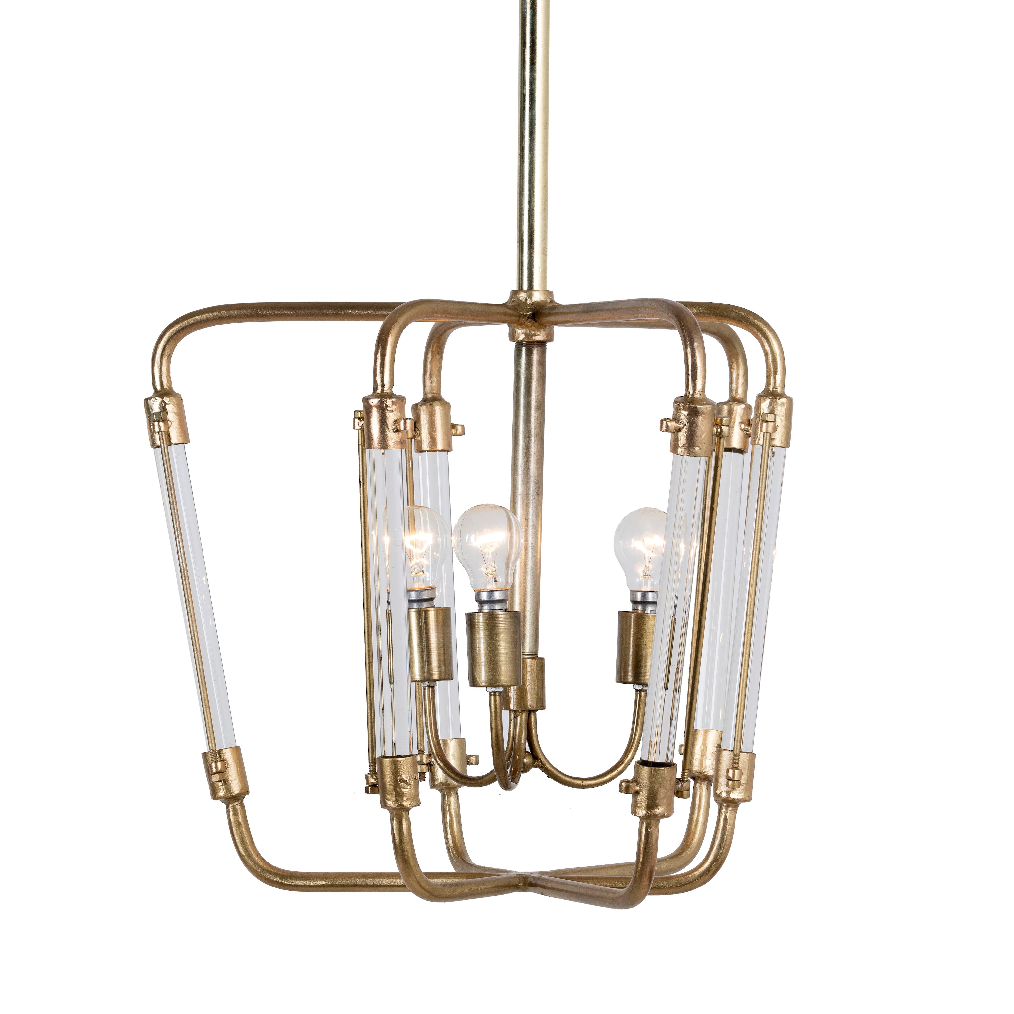 A vintage brass finish pendant light with a geometric iron frame and test tube-shaped glass shades, with multiple light bulbs.