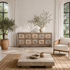 Life style imagination of a hand painted mango wood chest of 10 drawers with elephant and floral motifs; hand painted furniture for a boho chic living room, 200 × 41 × 85 cm.