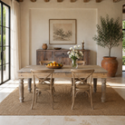 Lifestyle image of a of a sandblasted reclaimed wood dining table with carved legs, sustainable dining room furniture, 220×100×75 cm.