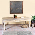 Side angle image of a sandblasted reclaimed wood dining table with carved legs, sustainable dining room furniture, 220×100×75 cm.