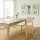 Lifestyle imagination of a of a sandblasted reclaimed wood dining table with carved legs, sustainable dining room furniture, 220×100×75 cm.