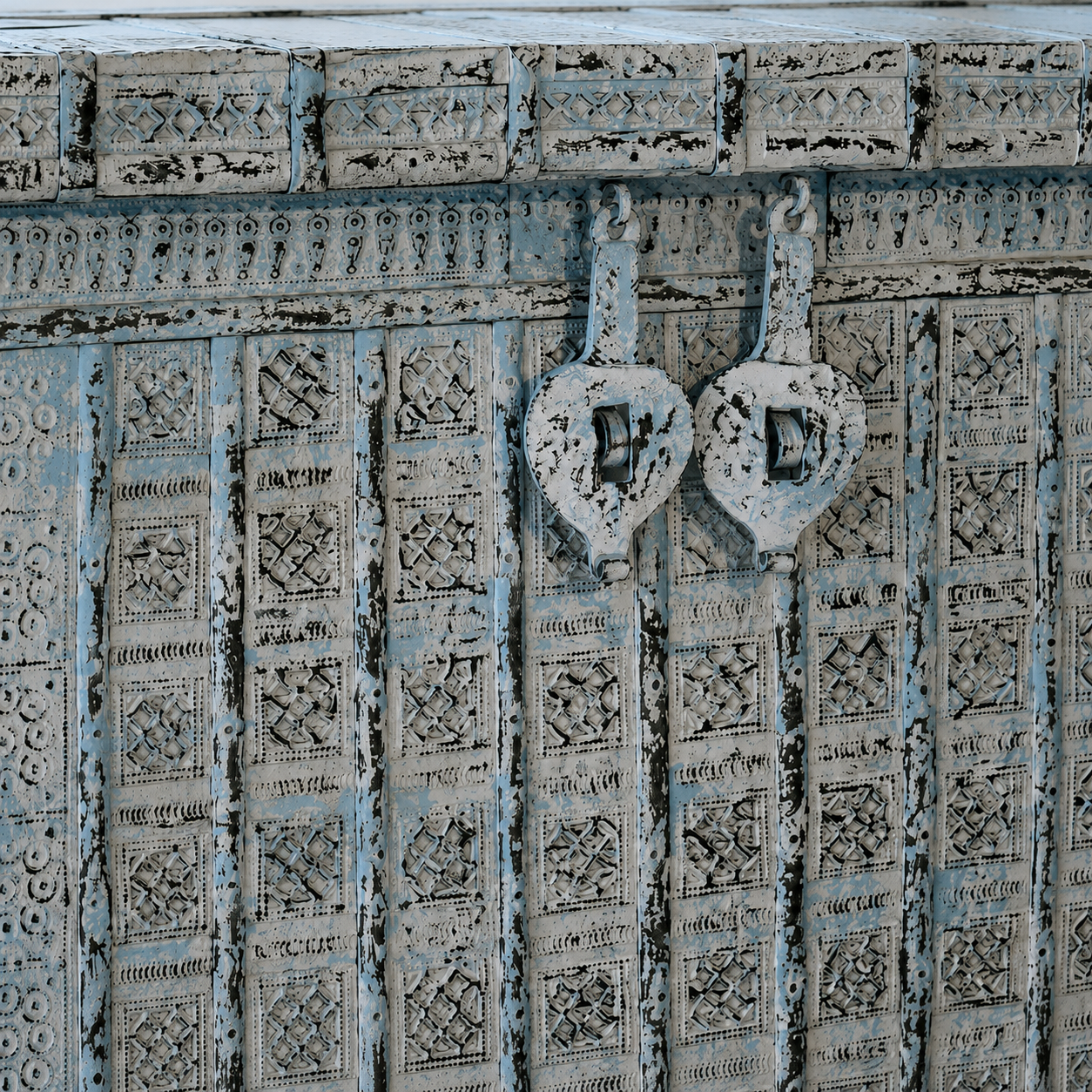Close up image of a antique Indian chest in blue with brass fittings – solid teak iron fitted wooden chest ideal for storing blankets, pillows, or decorative use.