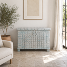 Lifestyle image of a antique Indian chest in blue with brass fittings – solid teak iron fitted wooden chest ideal for storing blankets, pillows, or decorative use.