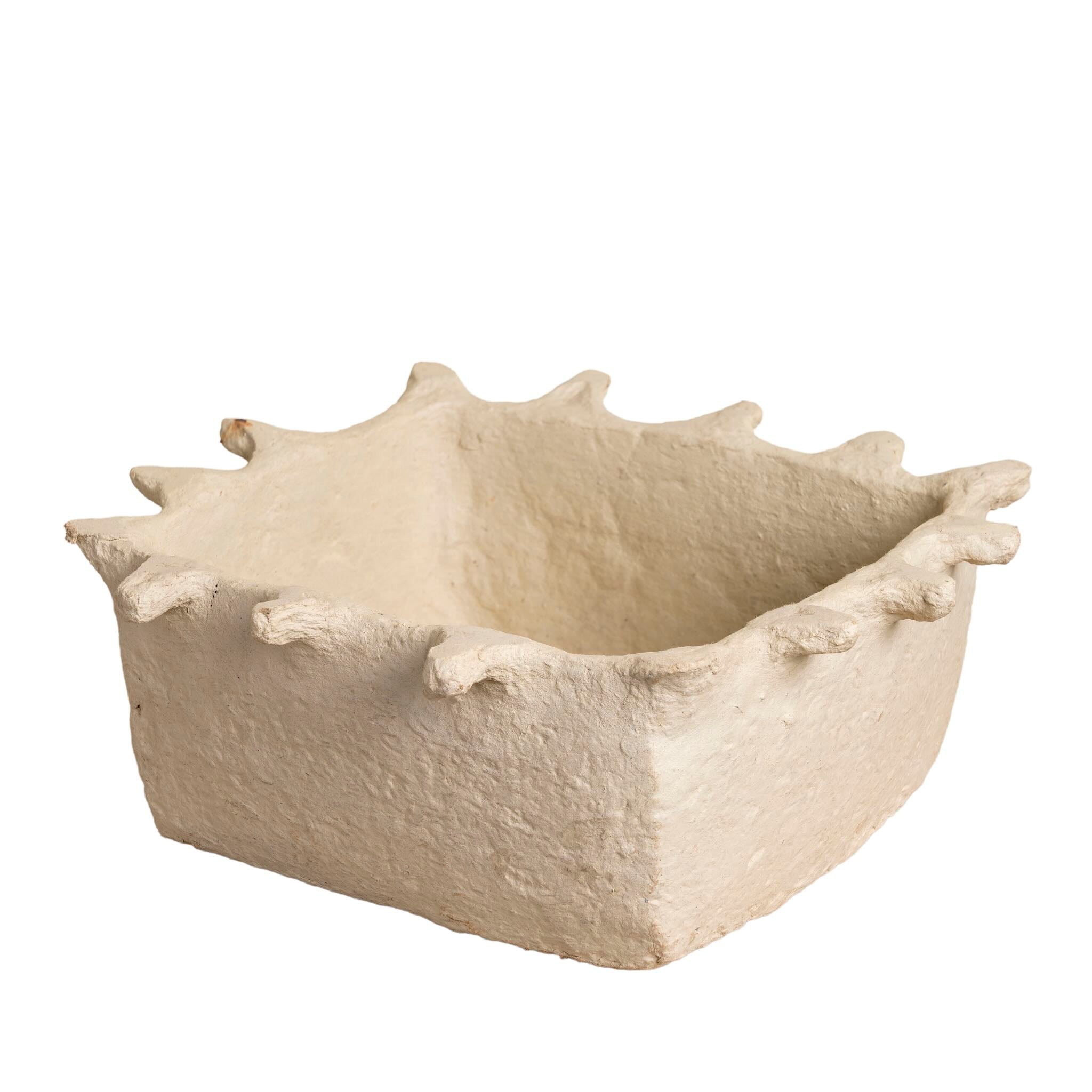 White backround image of a handmade papier-mâché bowl Dityaa in matte white with jagged edges. A sustainable vintage home accessory perfect for unique Indian decoration and vintage home decor, used in bathrooms, kitchens, or for dried plants.