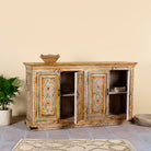 Open door image of a hand painted wooden dresser with floral and geometric motifs, reclaimed wood living room furniture in vintage boho style, 170 × 45 × 95 cm.