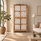 Lifestyle image of a of  a hand-carved mango wood wardrobe with floral motifs and whitewashed finish; wooden wardrobe ideal for bedroom furniture, 90 × 180 × 40 cm.
