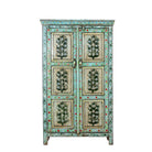 White background image of a hand-painted reclaimed wood cabinet with floral motifs and green frame – Drisina by Om Home & Garden, a unique piece of sustainable furniture with bohemian flair.