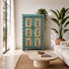 Lifestyle image of a Hand-painted reclaimed wood cabinet with floral motifs and green frame – Drisina by Om Home & Garden, a unique piece of sustainable furniture with bohemian flair.