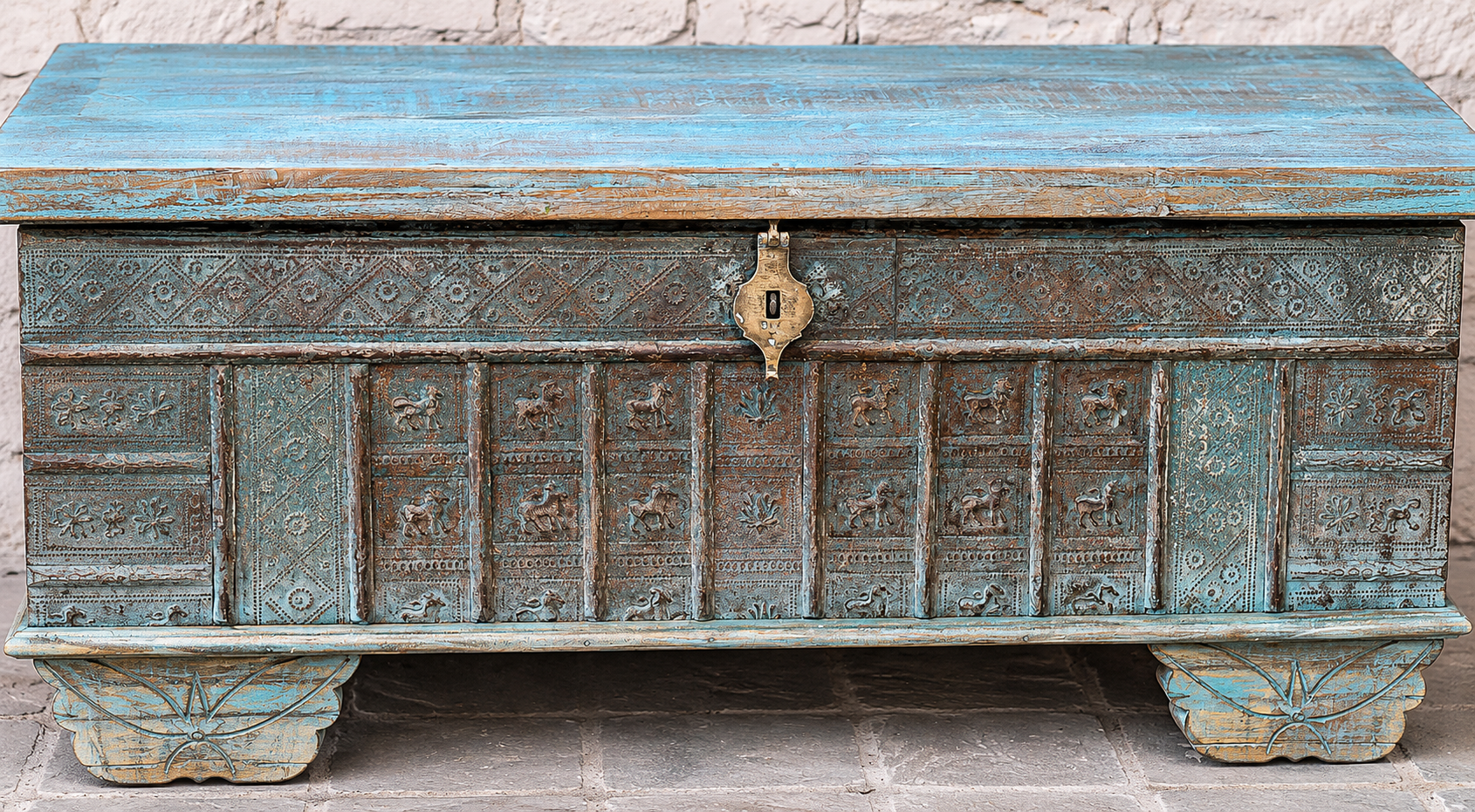 Close up image of a antique Indian chest coffee table in blue with brass fittings – iron fitted wooden chest made from solid teak, ideal for living rooms with storage space.