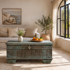 Lifestyle image of a antique Indian chest coffee table in blue with brass fittings – iron fitted wooden chest made from solid teak, ideal for living rooms with storage space.