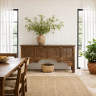 Lifestyle image of a teak wood console table made from reclaimed Indian door parts; handcrafted old door furniture, 183 × 90 × 43 cm.