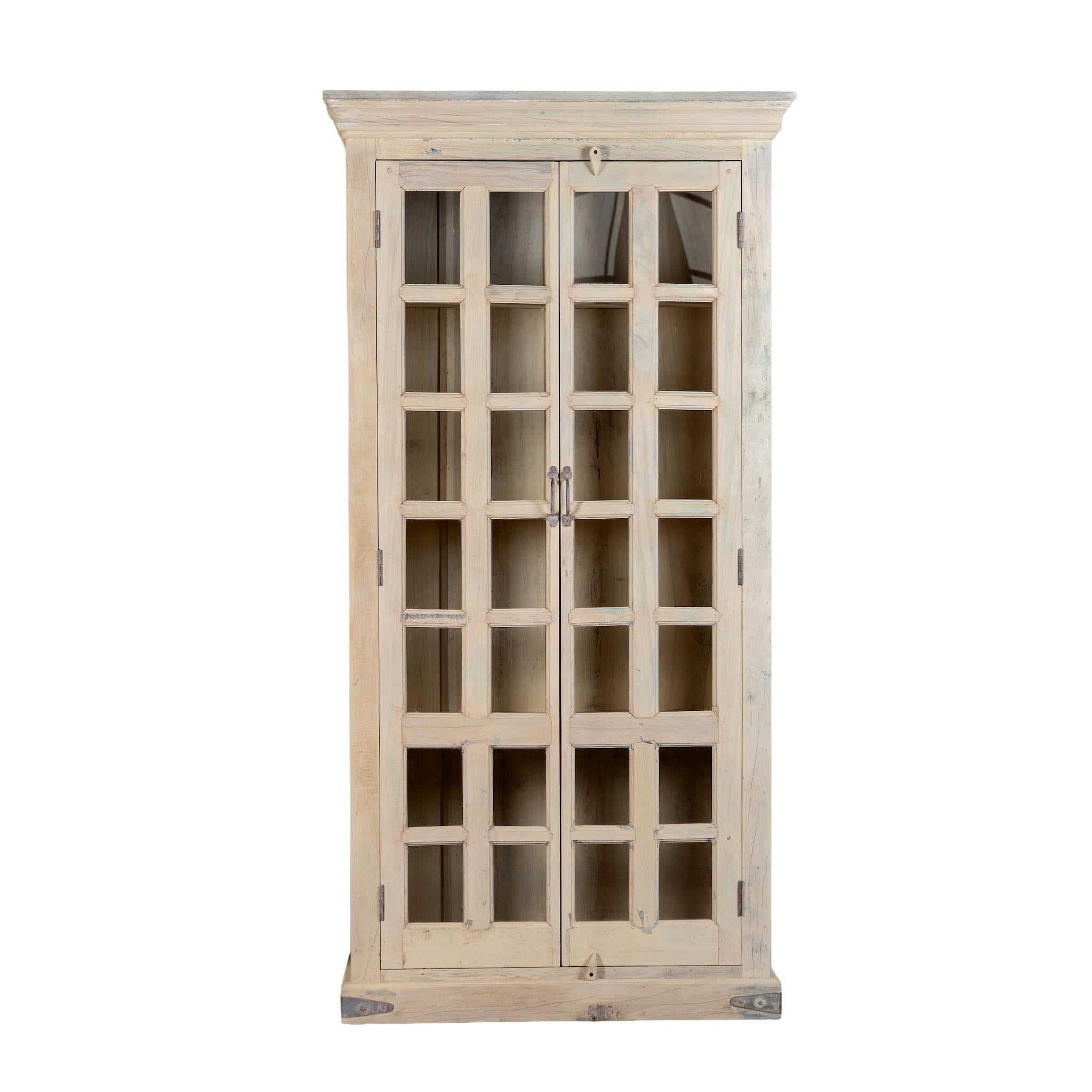 White background image of a reclaimed wood display cabinet Eknoor with glass-panelled doors and natural weathered finish. Sustainable living room furniture that can also function as a reclaimed wood wardrobe with spacious shelving.