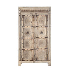 White background image of a reclaimed teak wood cabinet Elayna featuring an antique Indian door with carved motifs and iron accents. A unique piece of old door furniture in Mediterranean style, offering practical storage and historic charm.