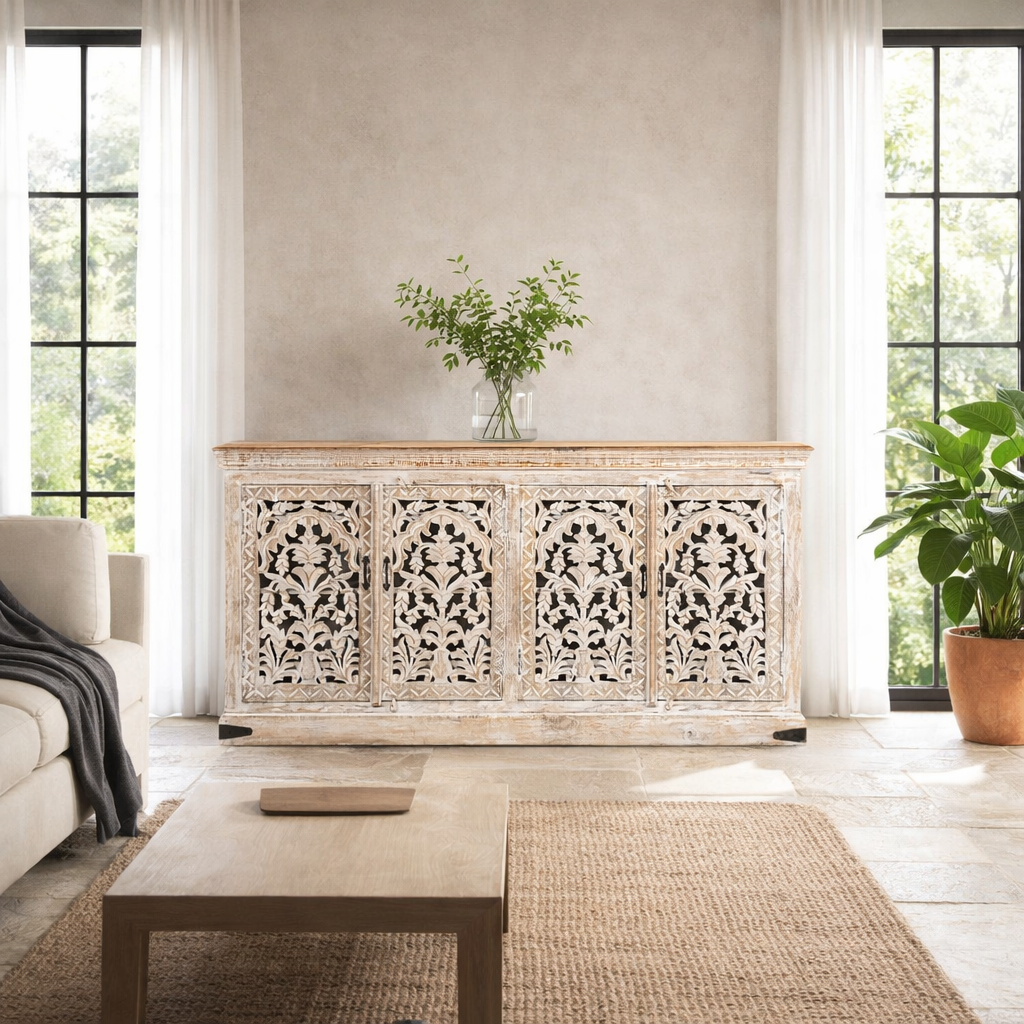 Life style image of a hand-carved whitewashed mango wood sideboard with intricate floral detailing, perfect for a boho chic living room or vintage-inspired interior.