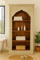 Lifestyle image of a hand-carved mango wood bookcase with Mediterranean design and open shelving – mango wood shelving and hand carved wooden furniture with natural finish.