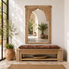 Lifestyle image of a Farida reclaimed teak wood wall mirror made from an original carved Indian window frame with bleached finish 165cm