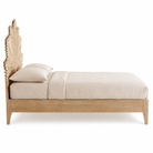 Side view image of a mango wood bed frame with a hand carved headboard in Farn design.