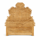 Close up image of a mango wood bed frame with a hand carved headboard in Farn design.