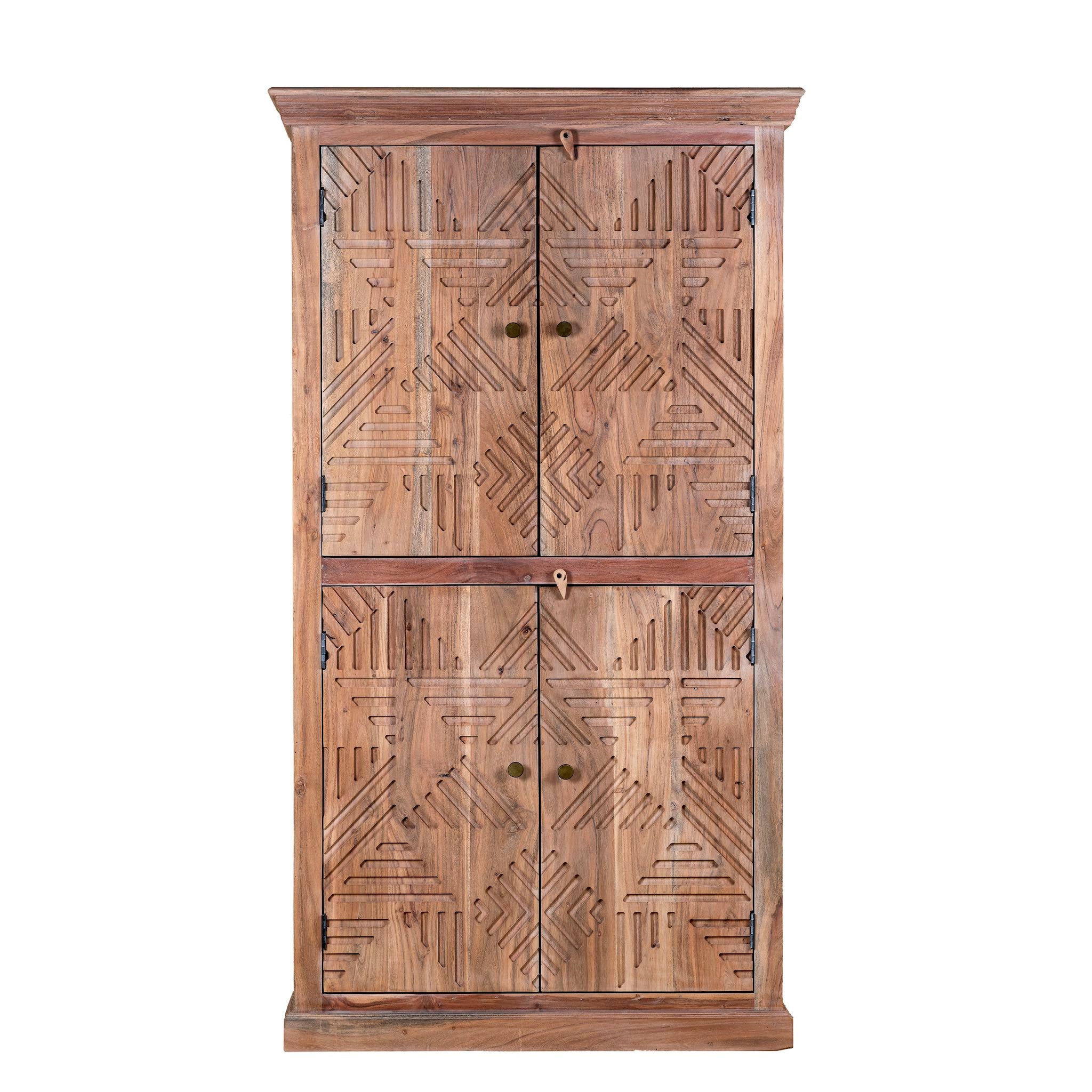 White background view of a hand crafted acacia wood cabinet with 4 doors, brass fitted door knobs and geometrical carvings.