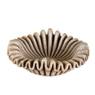 White background image of a Hand-carved folded beige marble bowl with wave-shaped rim and radial design, ideal for vintage home decoration and Indian home decor.