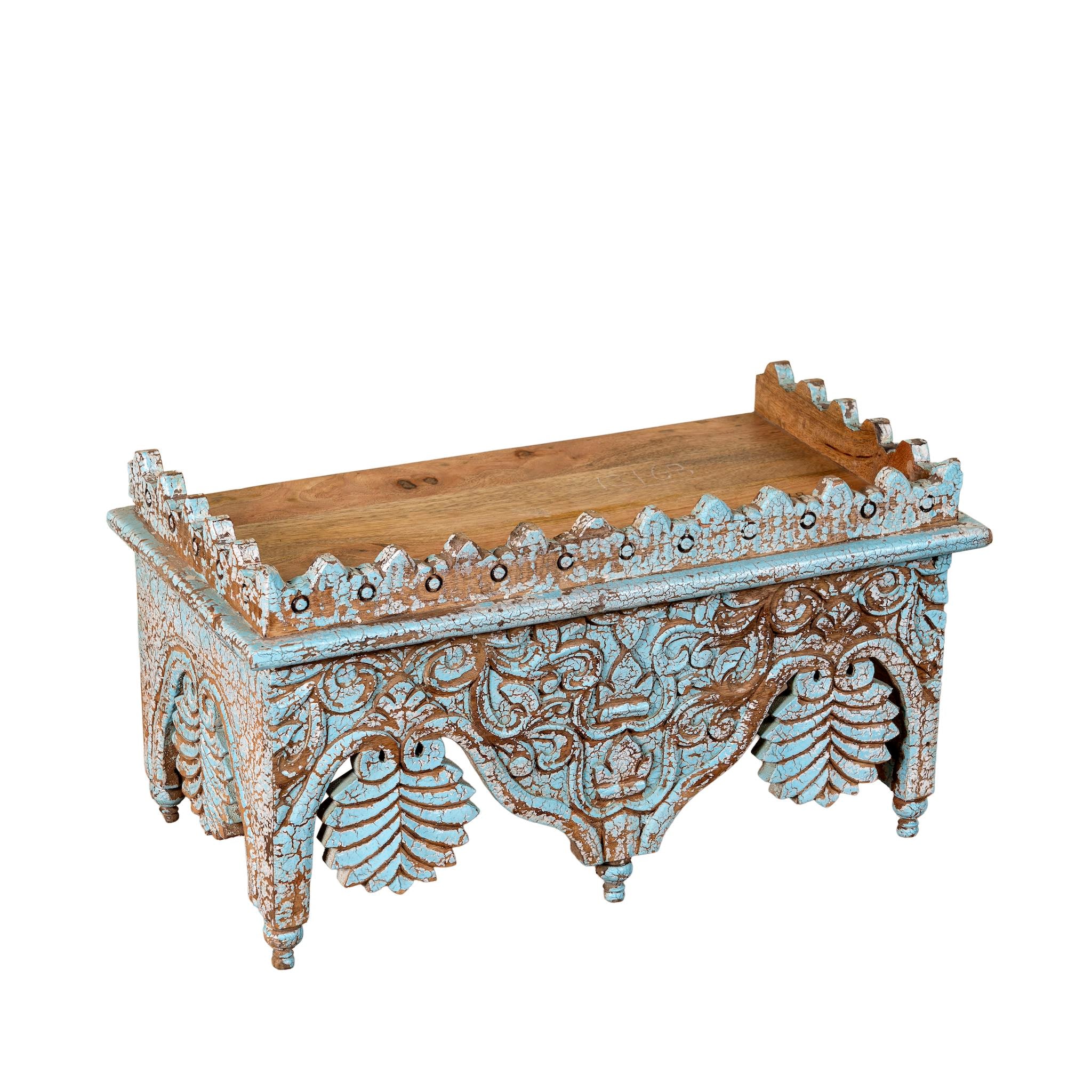 Side angle image of a turquoise distressed mango wood shelf with ornate carvings; artisanal furniture and vintage home decor, 60 × 32 × 32 cm.