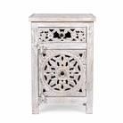 White background image of a whitewashed nightstand made of mango wood with Mediterranean-style carved detailing and one drawer – Gagan bedside table by Om Home & Garden