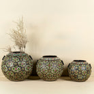 Set of 3 round hand-painted iron pots with silver floral designs on blue background, artisanal Indian home accessories and vintage decor accents.